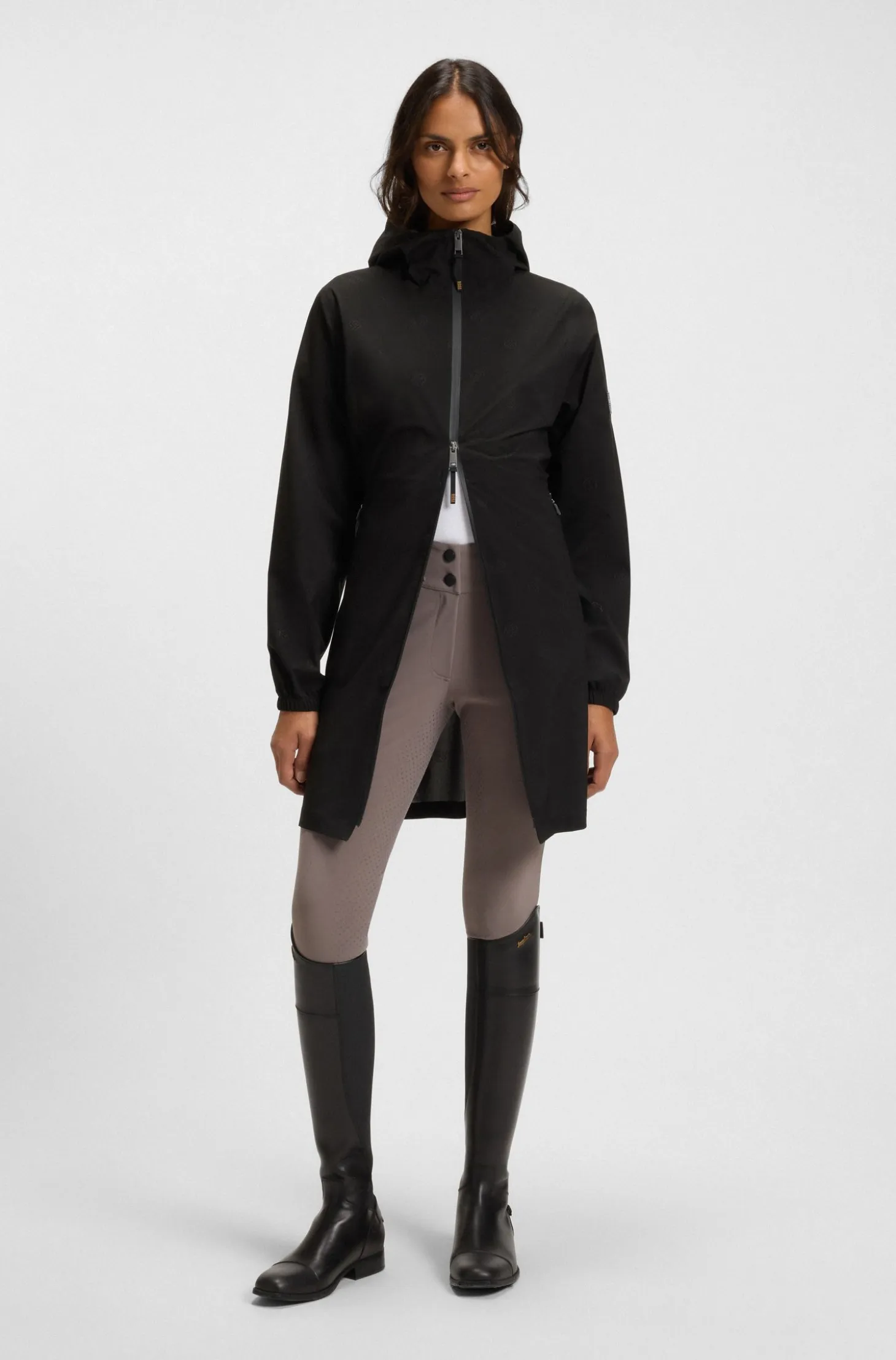 Equestrian waterproof raincoat with adjustable rear zips