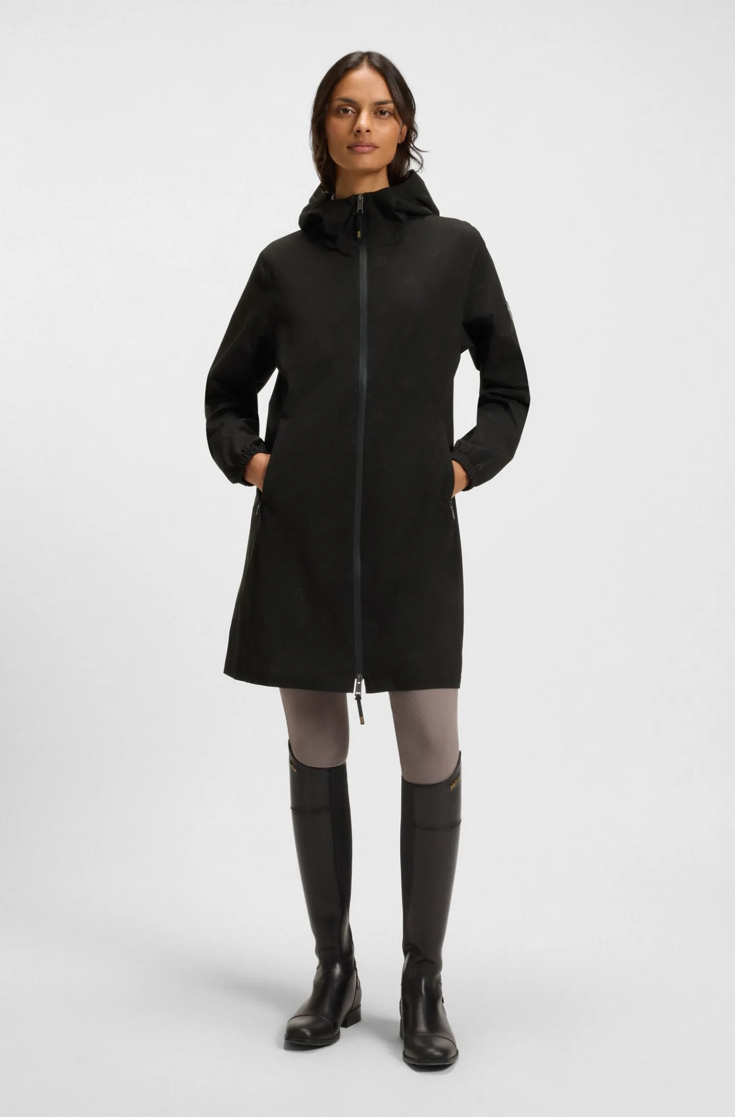 Equestrian waterproof raincoat with adjustable rear zips