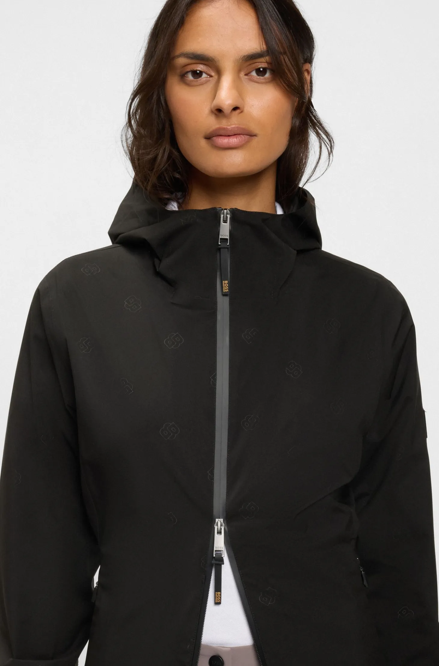 Equestrian waterproof raincoat with adjustable rear zips
