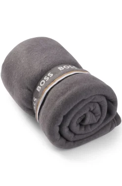 Fleece throw with signature-stripe ribbon