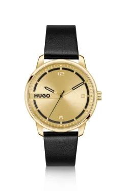 Gold-tone watch with black leather strap