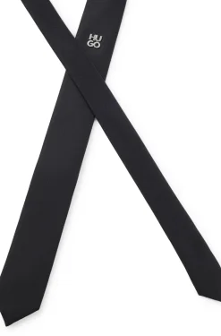 Jacquard-woven tie with metallic stacked-logo trim