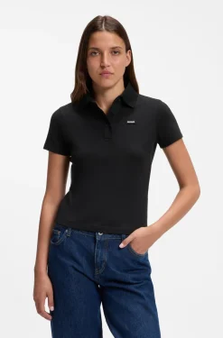 Knit polo in stretch-cotton piqué with logo badge