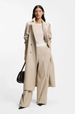 Knitted cardigan with rear button closure