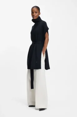 Knitted poncho in virgin wool with high neckline