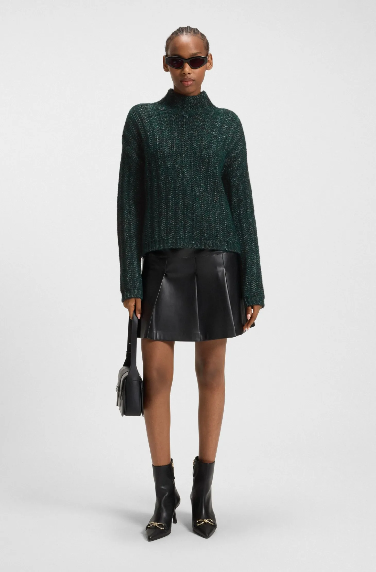 Knitted sweater with ribbed structure