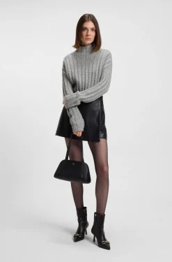 Knitted sweater with ribbed structure