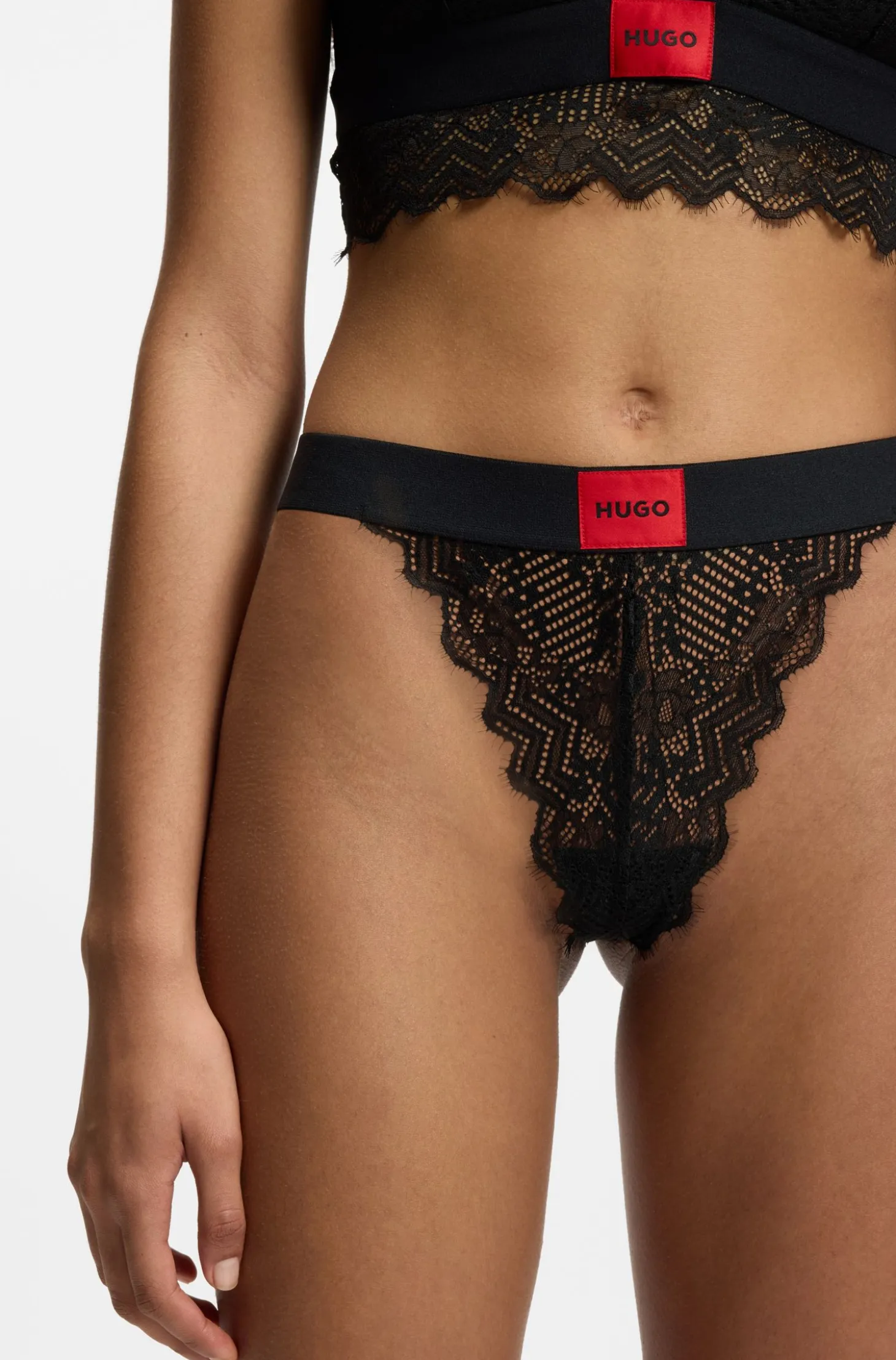 Lace thong with red logo label