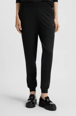 Logo-print tracksuit bottoms in stretch modal and cotton