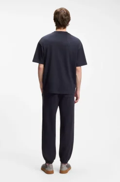 Loose-fit T-shirt in cotton with suede logo badge