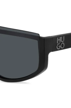 Mask-style sunglasses in black with stacked logo
