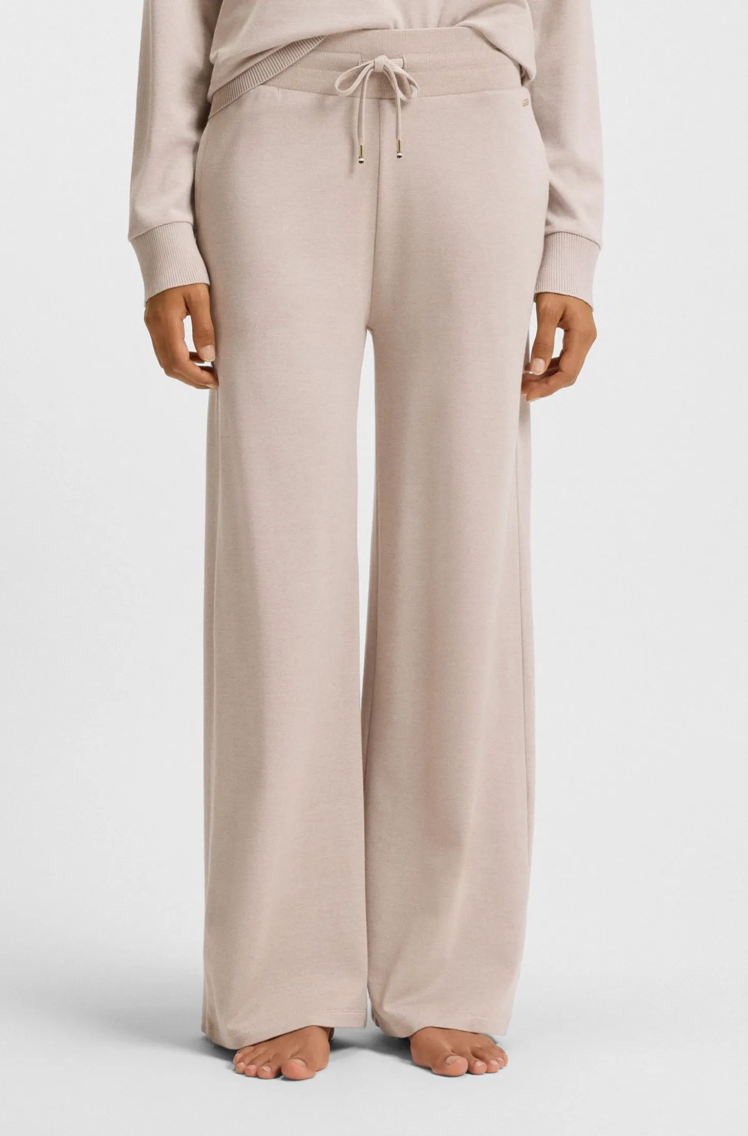 Melange-jersey tracksuit bottoms with logo plate