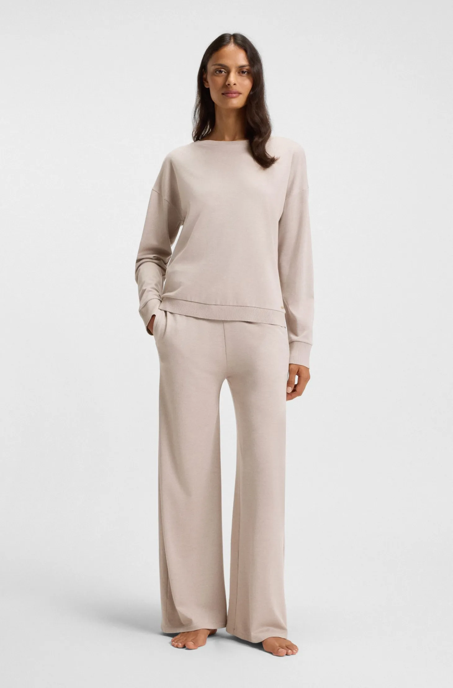 Melange-jersey tracksuit bottoms with logo plate