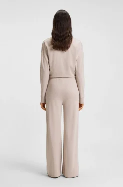 Melange-jersey tracksuit bottoms with logo plate
