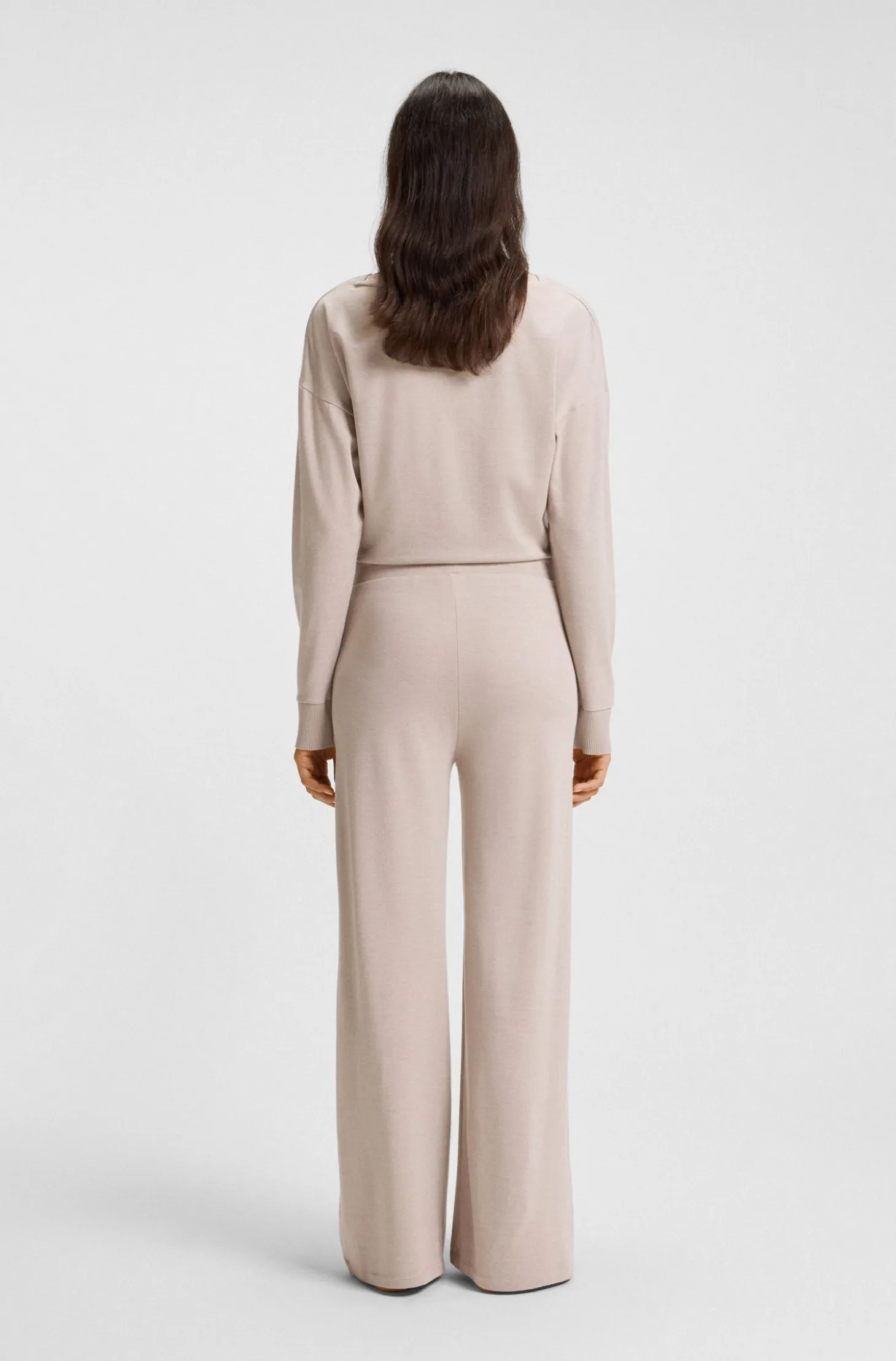 Melange-jersey tracksuit bottoms with logo plate