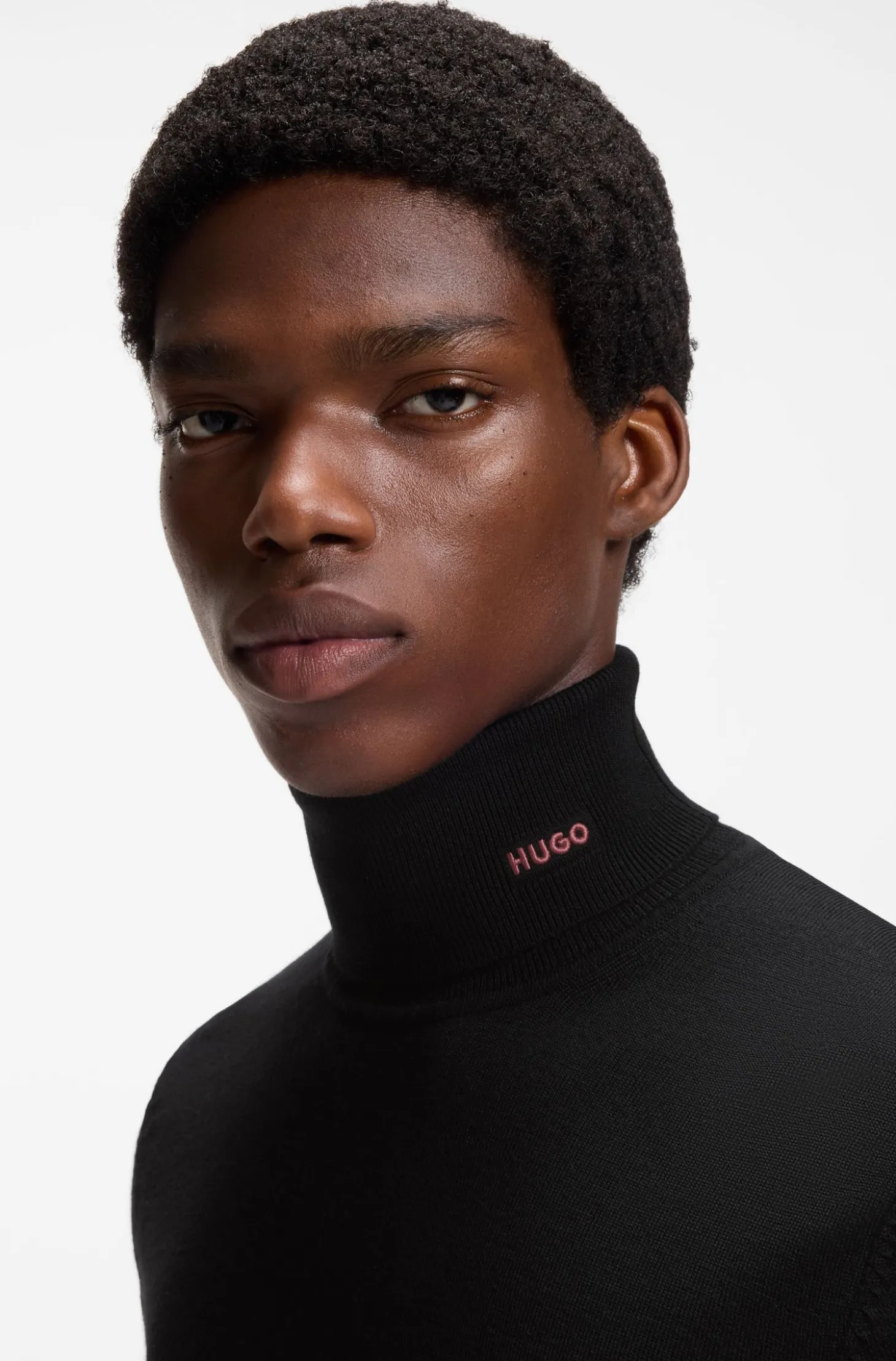 Merino-wool rollneck sweater with embroidered logo