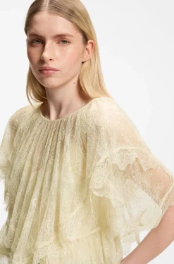 Mini cape blouse with lace trimmings