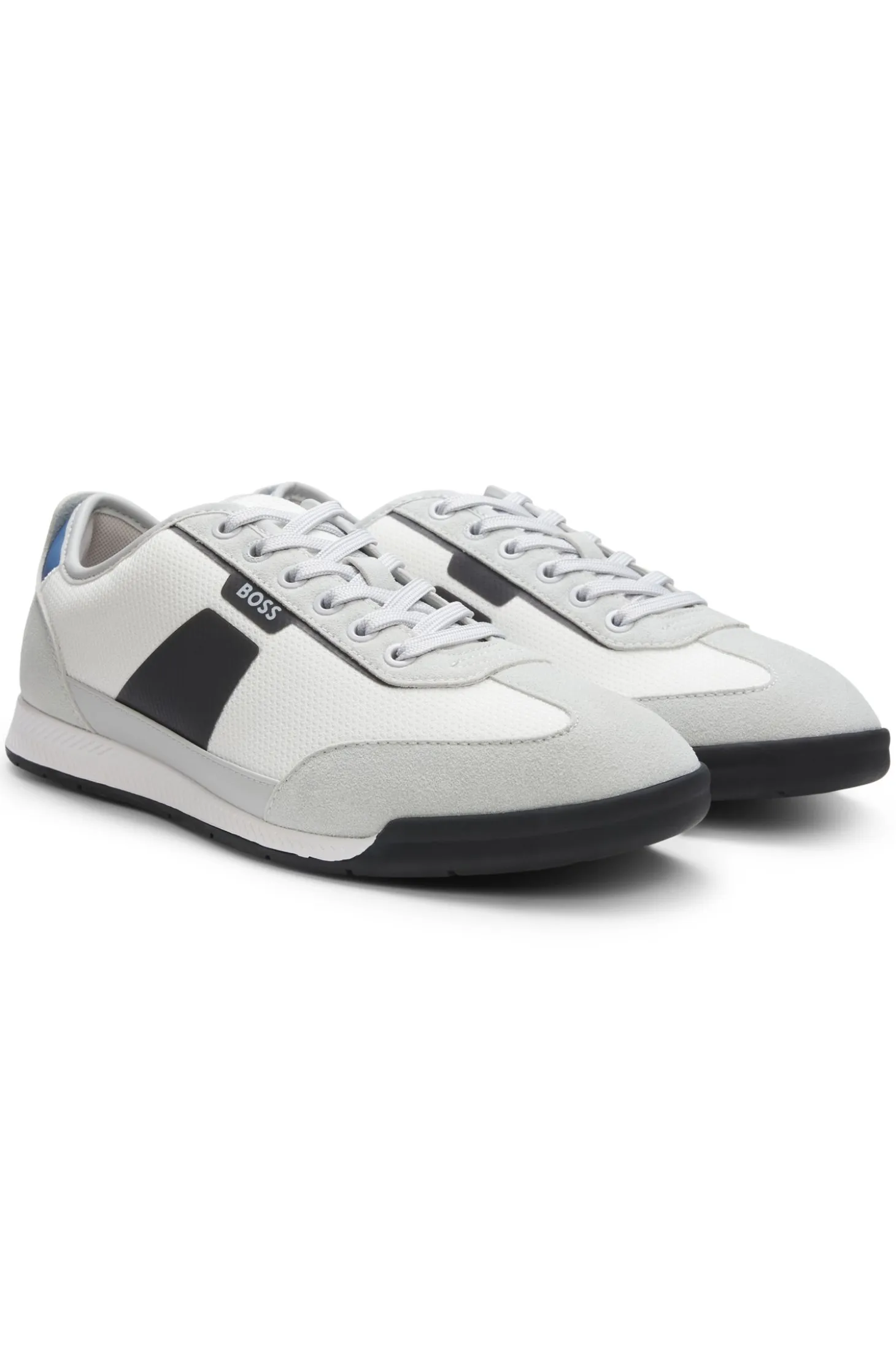 Mixed-material trainers with ridged outsole