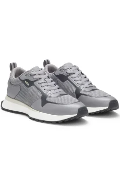 Mixed-material trainers with mesh details and branding