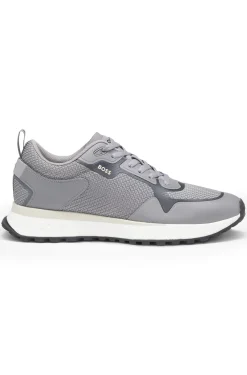 Mixed-material trainers with mesh details and branding