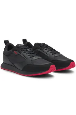 Mixed-material trainers with branded accents