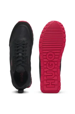 Mixed-material trainers with branded accents