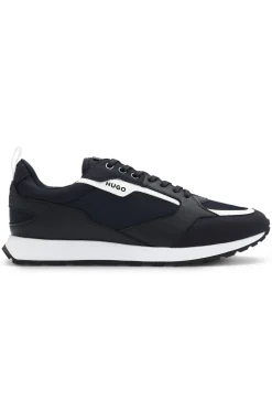 Mixed-material trainers with branded accents