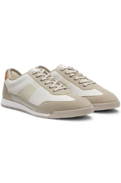 Mixed-material trainers with ridged outsole
