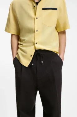 Modern-fit trousers in stretch-cotton seersucker