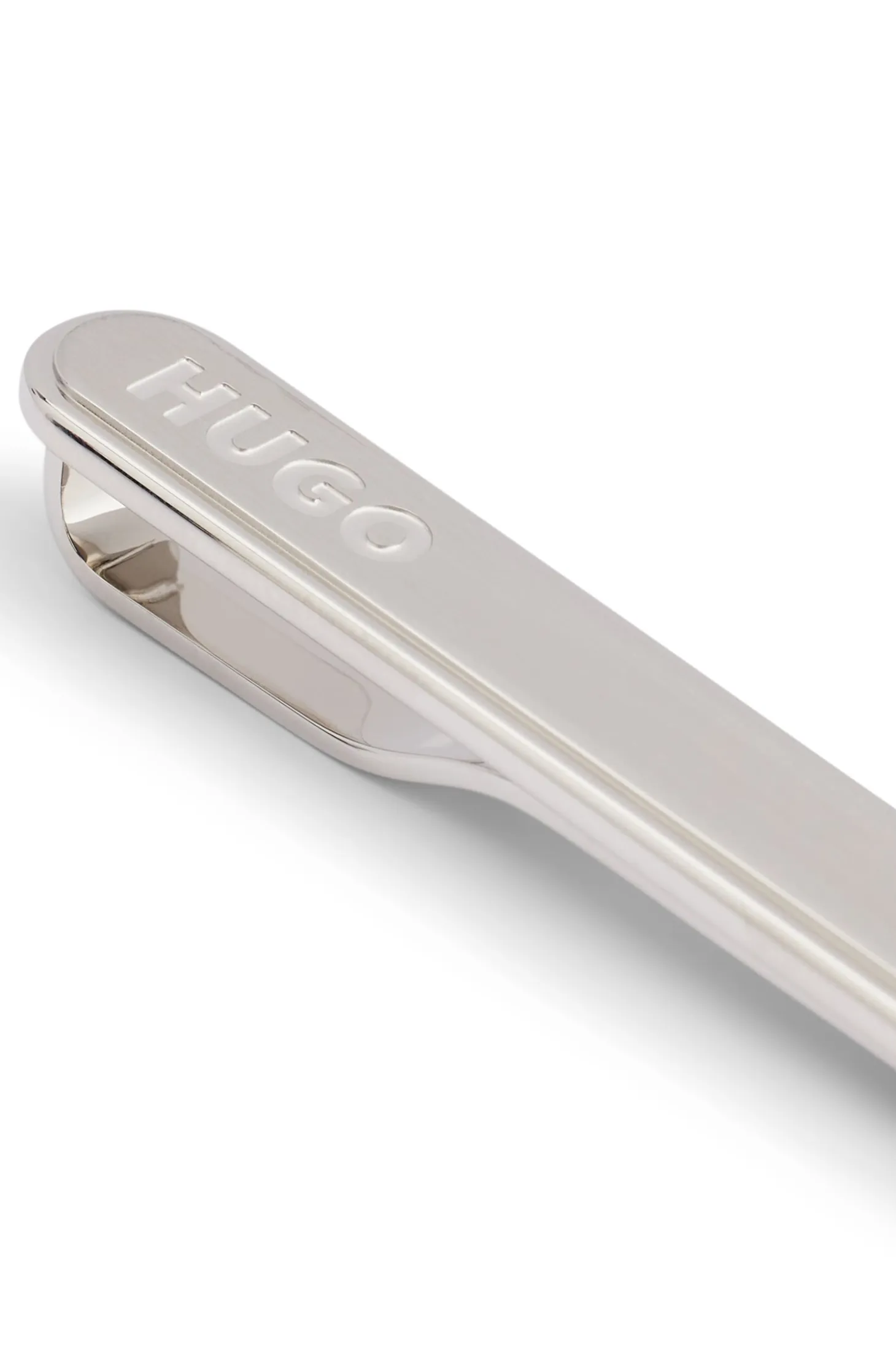 Oval-shaped tie clip with engraved logo