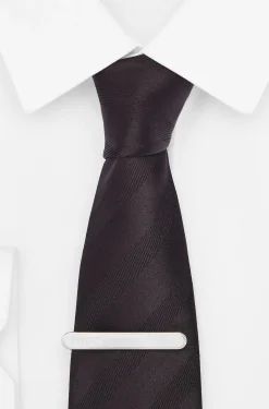 Oval-shaped tie clip with engraved logo