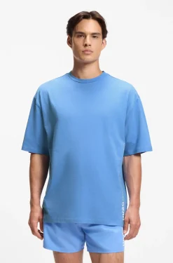 Oversized-fit T-shirt in cotton with repeat-logo print