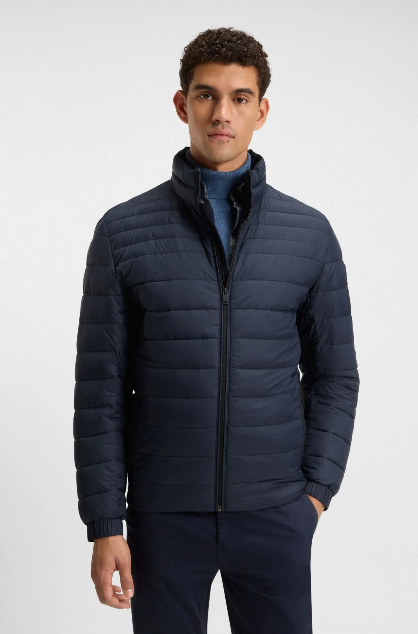 Packable water-repellent padded jacket with logo badge