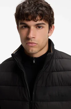 Padded gilet with a protective stand collar
