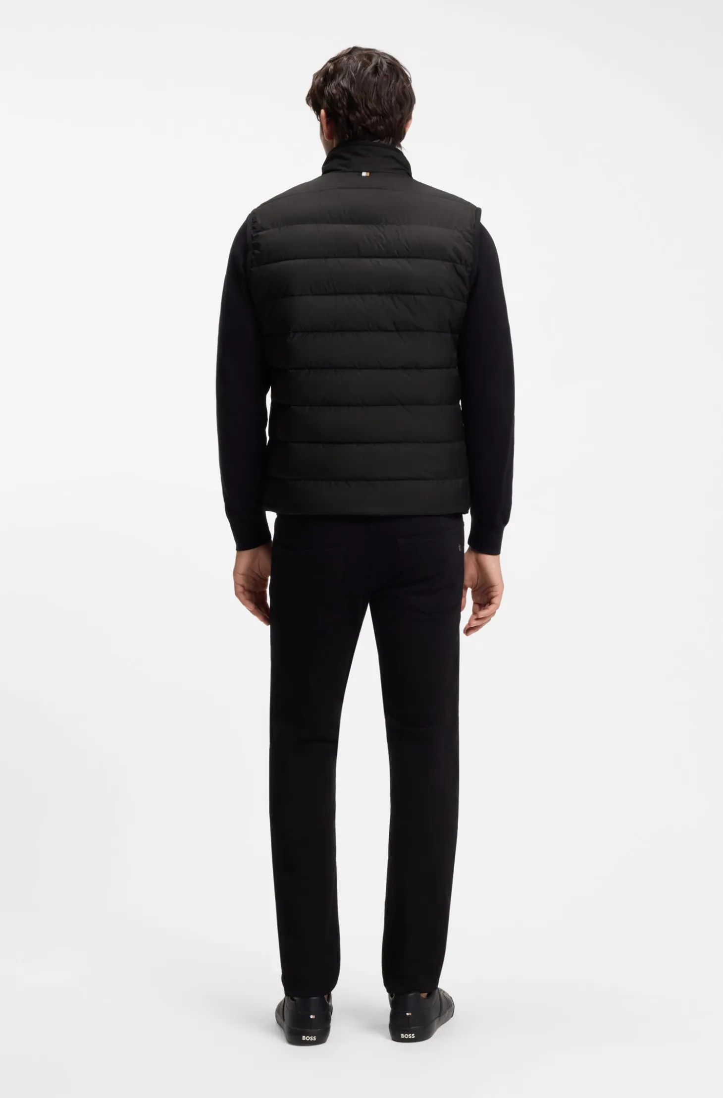 Padded gilet with a protective stand collar
