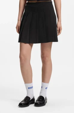 Pleated skirt in stretch cotton with integrated shorts