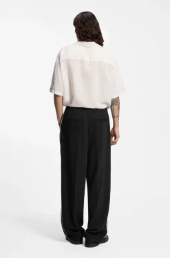 Pleat-front trousers with whipstitch details