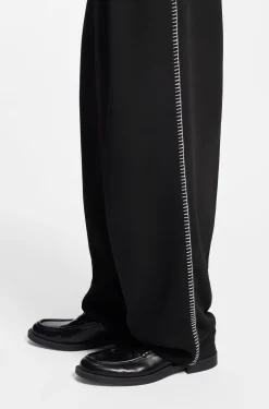 Pleat-front trousers with whipstitch details