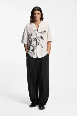 Pleat-front trousers with whipstitch details