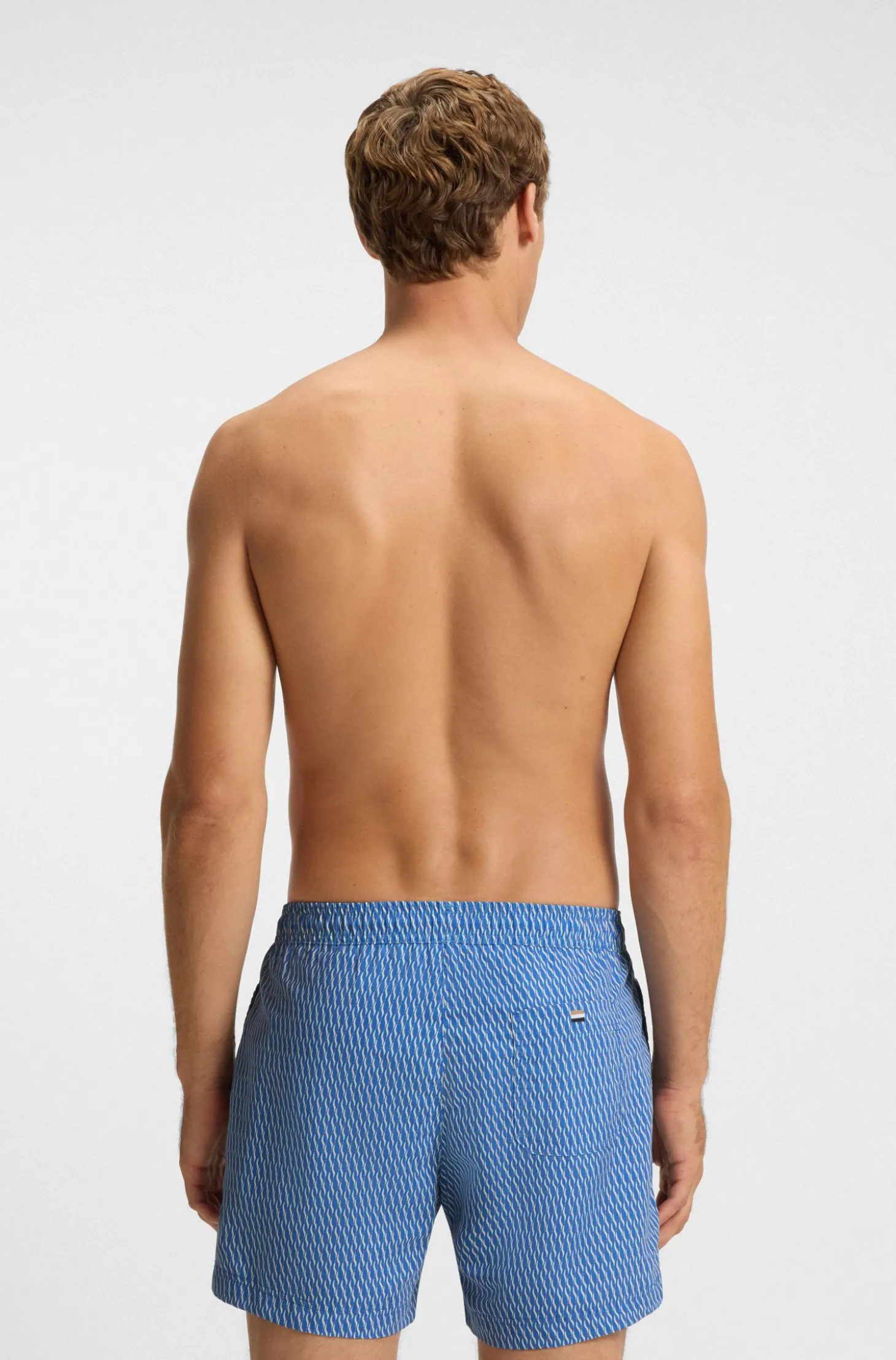 Printed swim shorts with logo badge