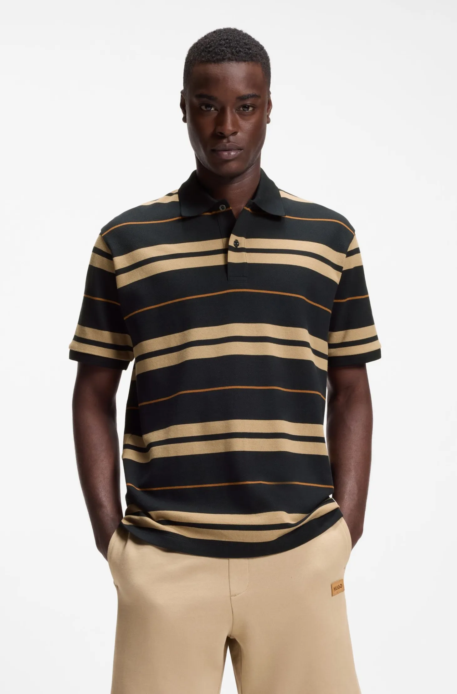 Regular-fit polo in cotton piqué with engineered stripes