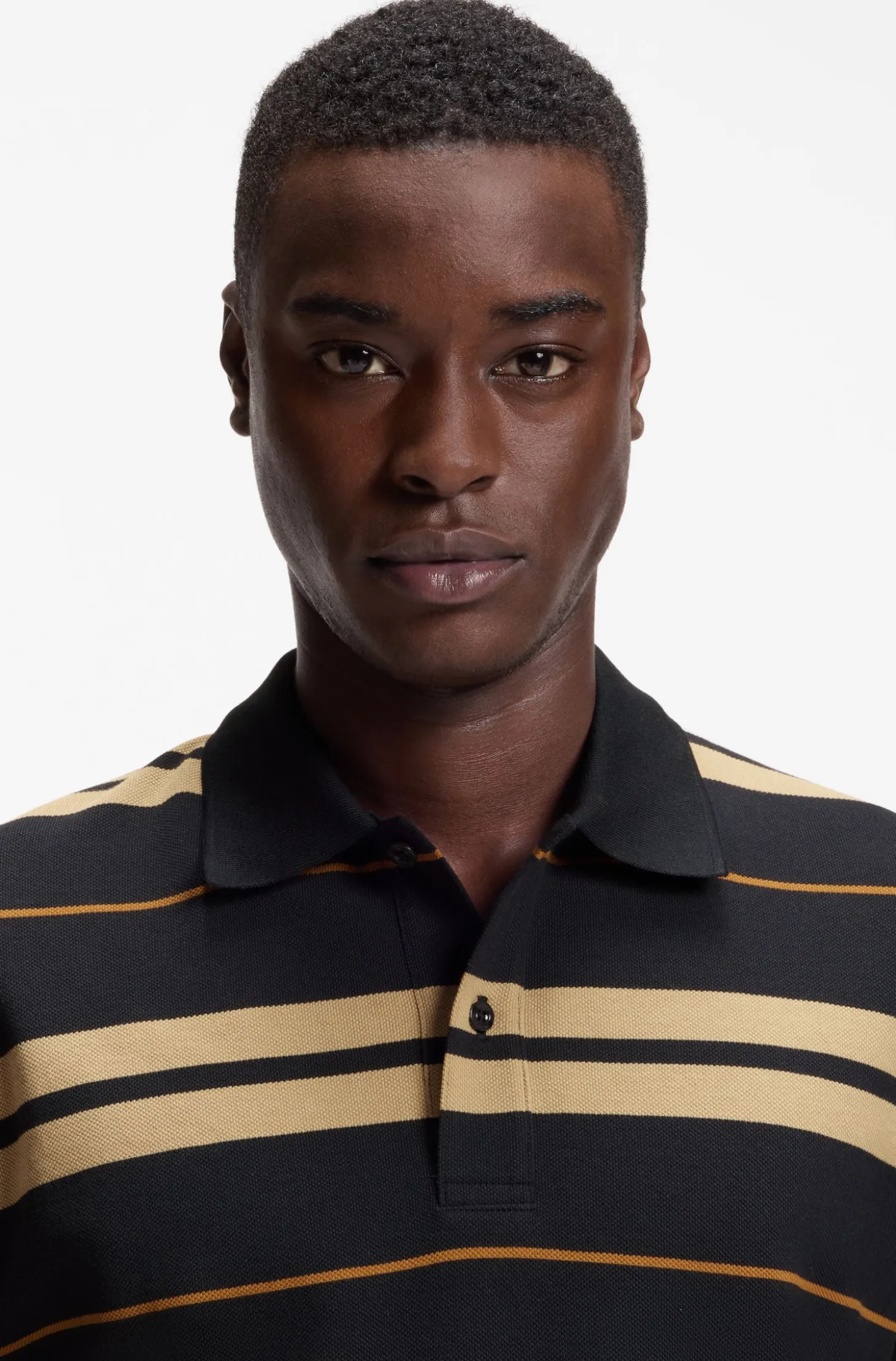 Regular-fit polo in cotton piqué with engineered stripes