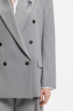 Relaxed-fit blazer with enamel flower brooch