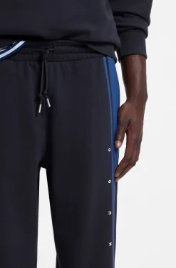 Relaxed-fit tracksuit bottoms in cotton with side stripe