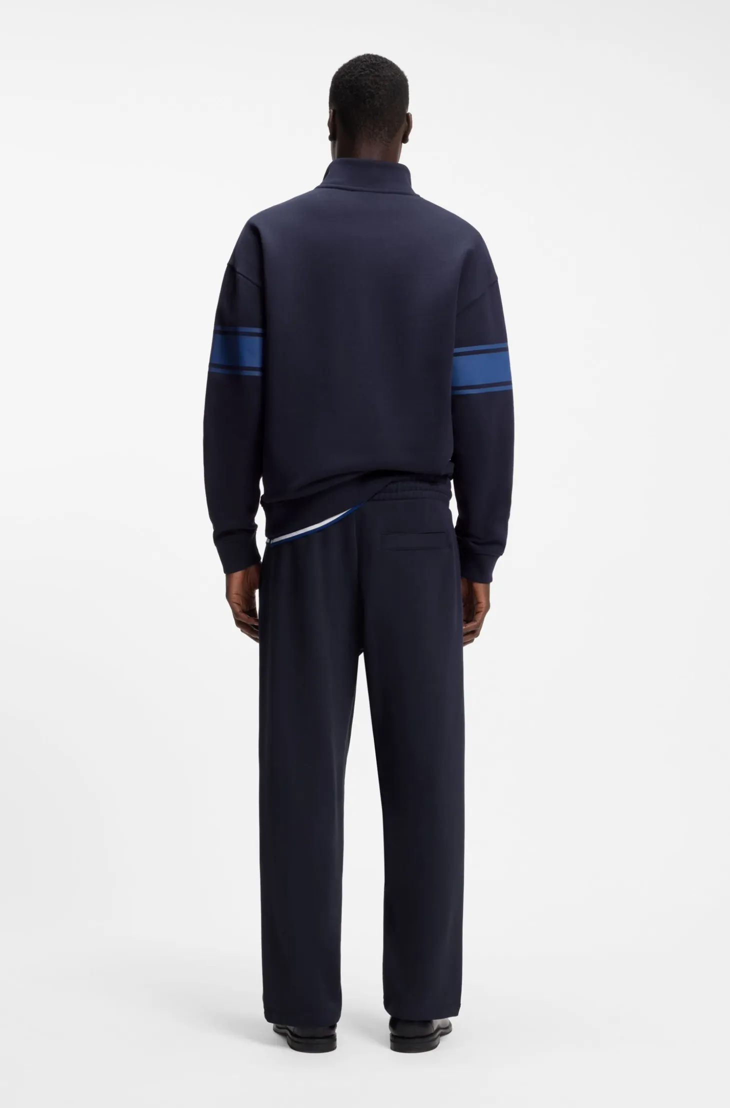 Relaxed-fit tracksuit bottoms in cotton with side stripe