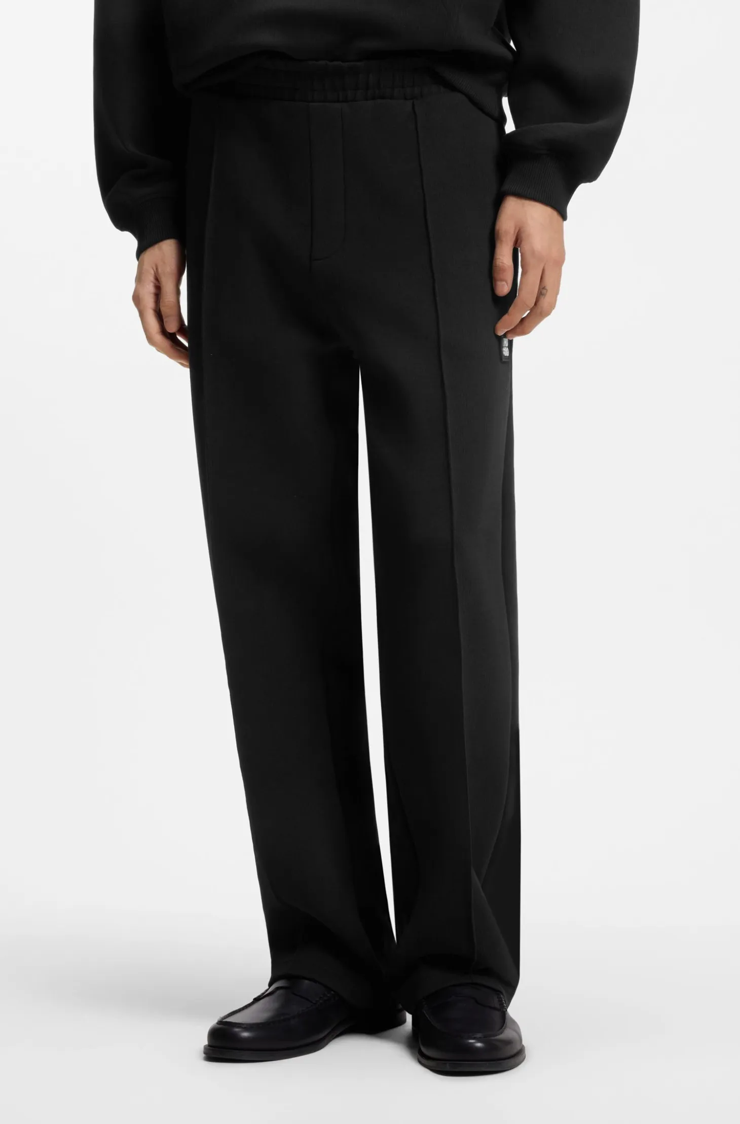 Relaxed-fit tracksuit bottoms in a structured cotton blend