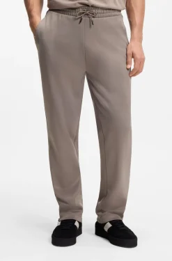 Relaxed-fit tracksuit bottoms with logo tape