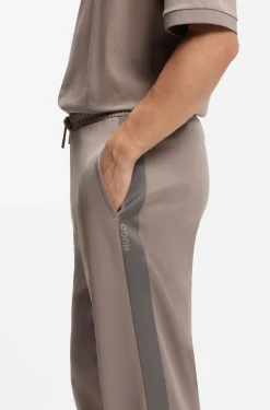 Relaxed-fit tracksuit bottoms with logo tape