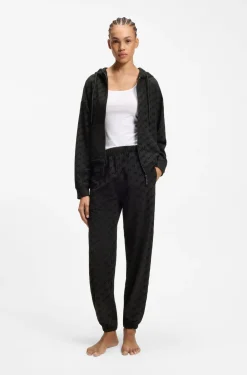 Relaxed-fit tracksuit bottoms with flocked-logo print