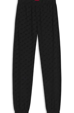 Relaxed-fit tracksuit bottoms with flocked-logo print